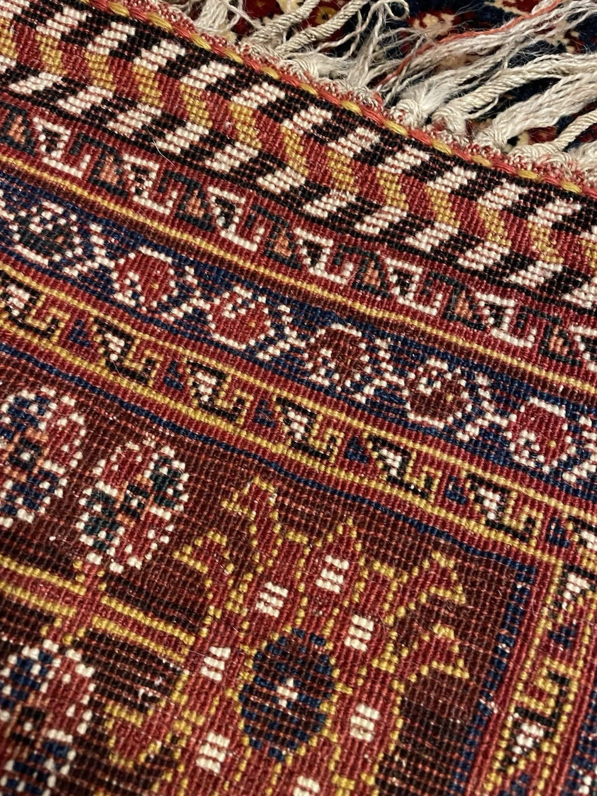 Central hexagonal medallion on red field