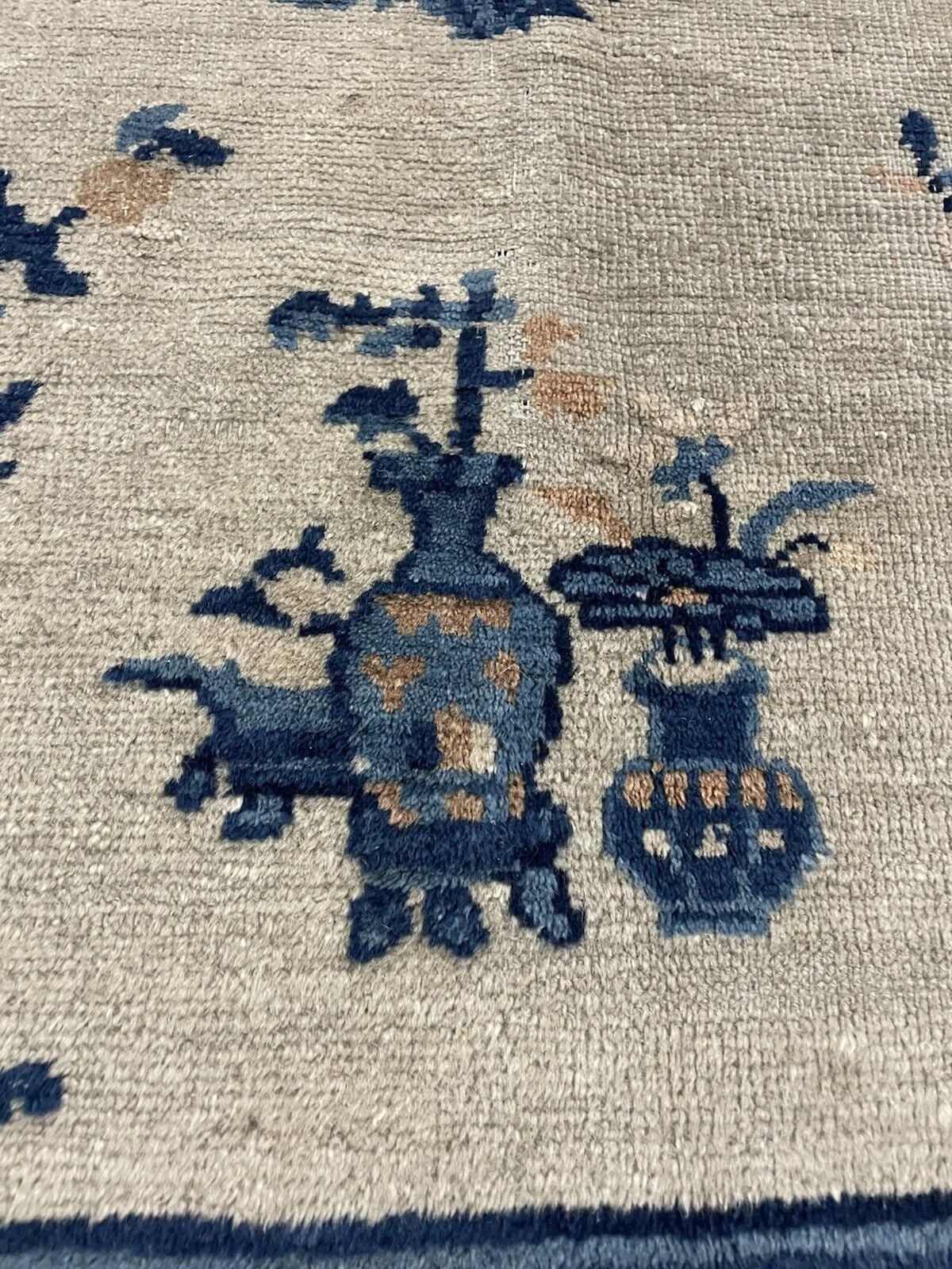 Muted color composition in antique Chinese rug