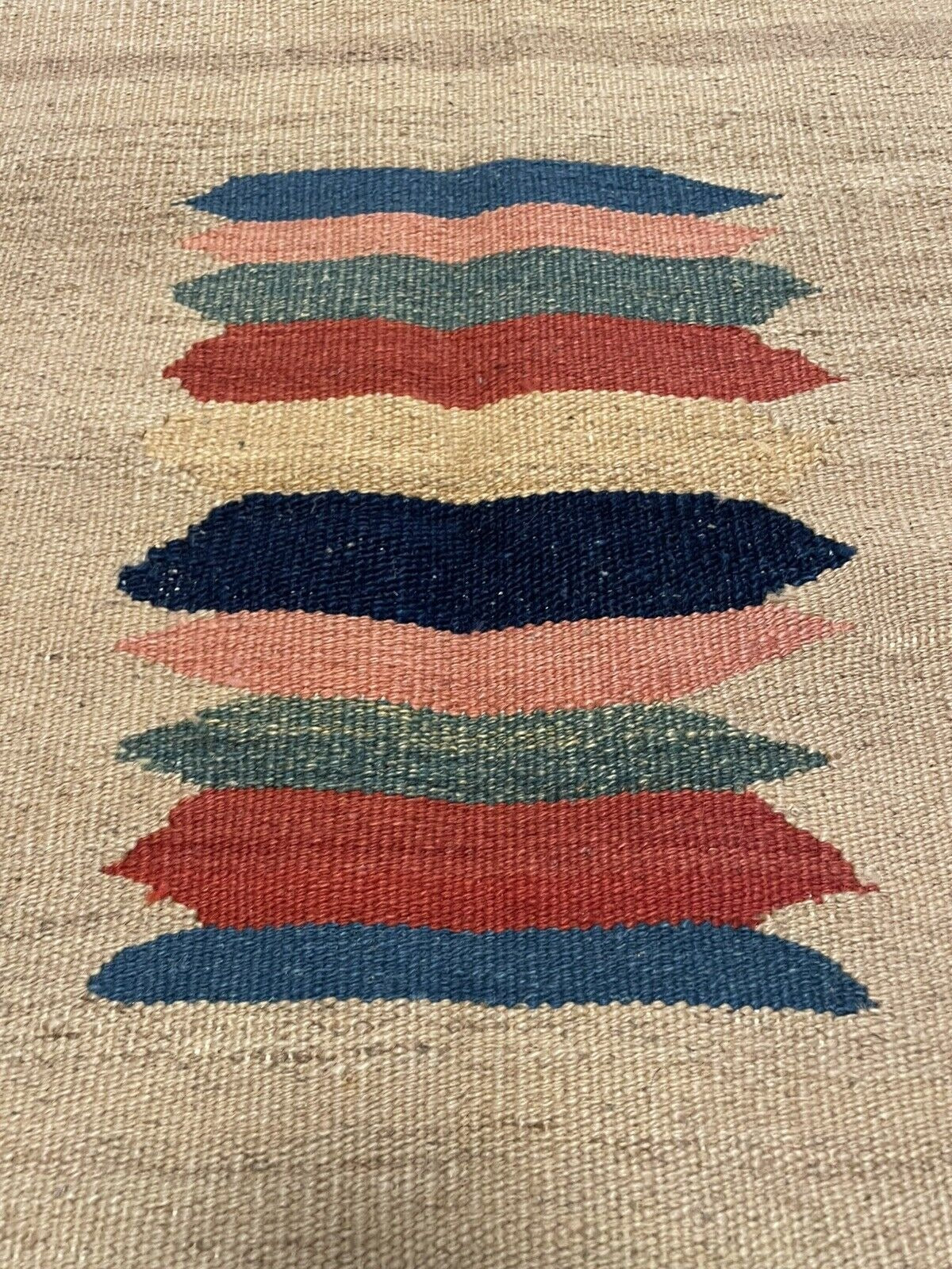 Crisp flat-weave showing clean edge artistry