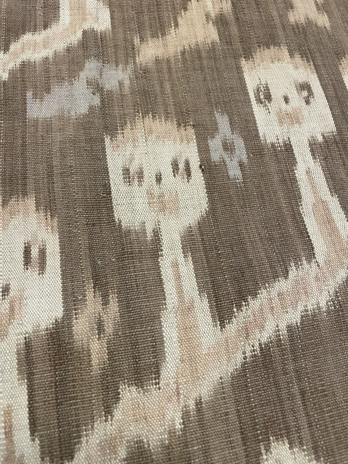 Close-up of the center seam on an antique Sumba hinggi, showing the fine join where two narrow backstrap-loom panels are united into a single cloth in the traditional manner.