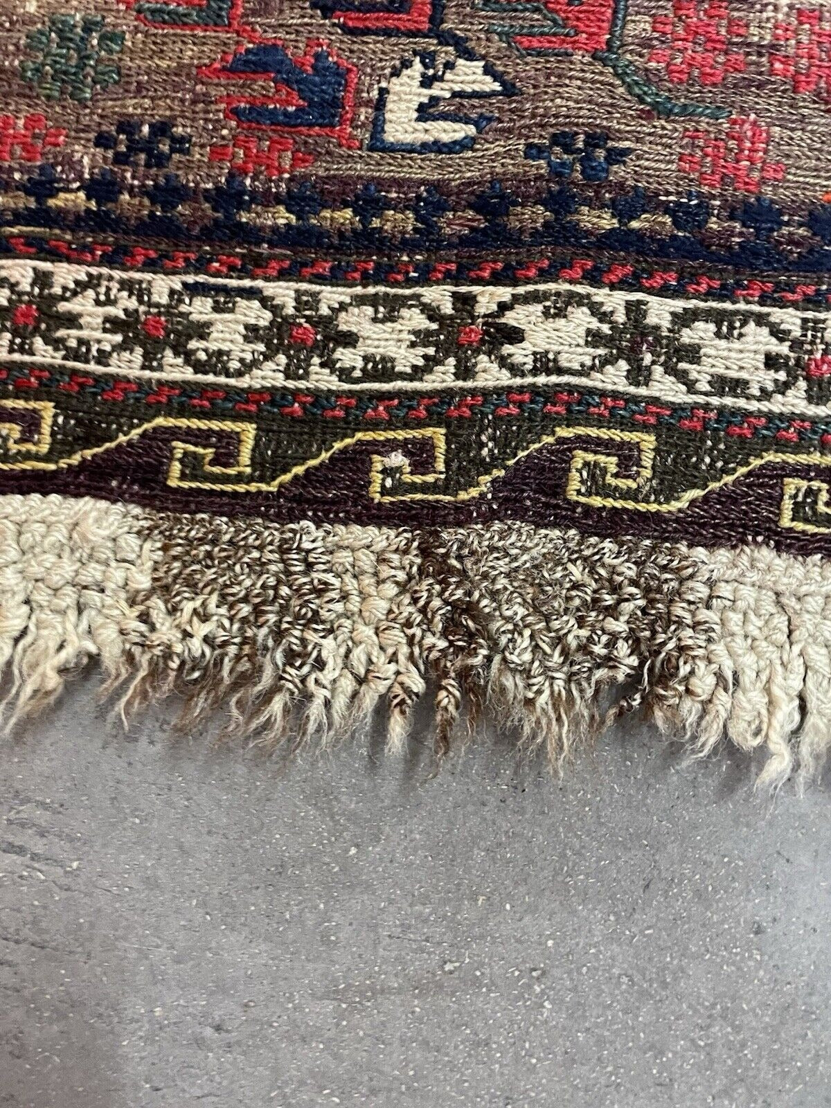 Gentle wear highlight in central areas of rug