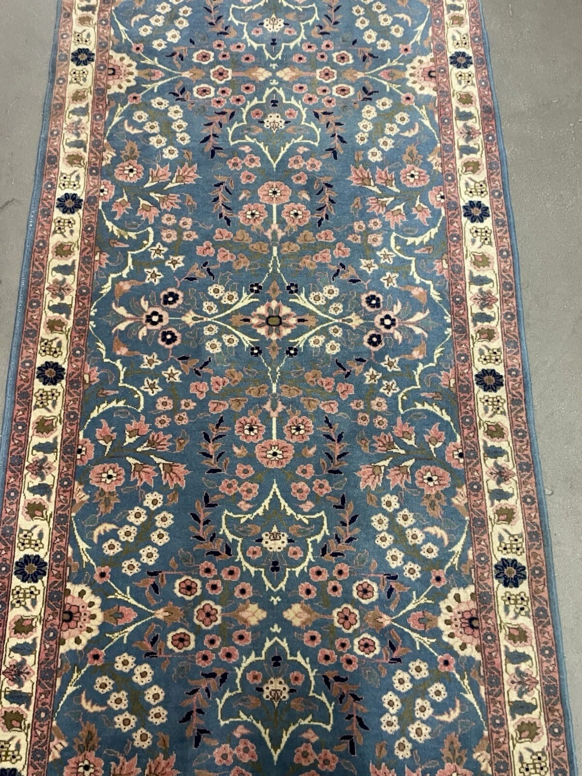 Side profile showcasing rug’s dense pile and fringe detail