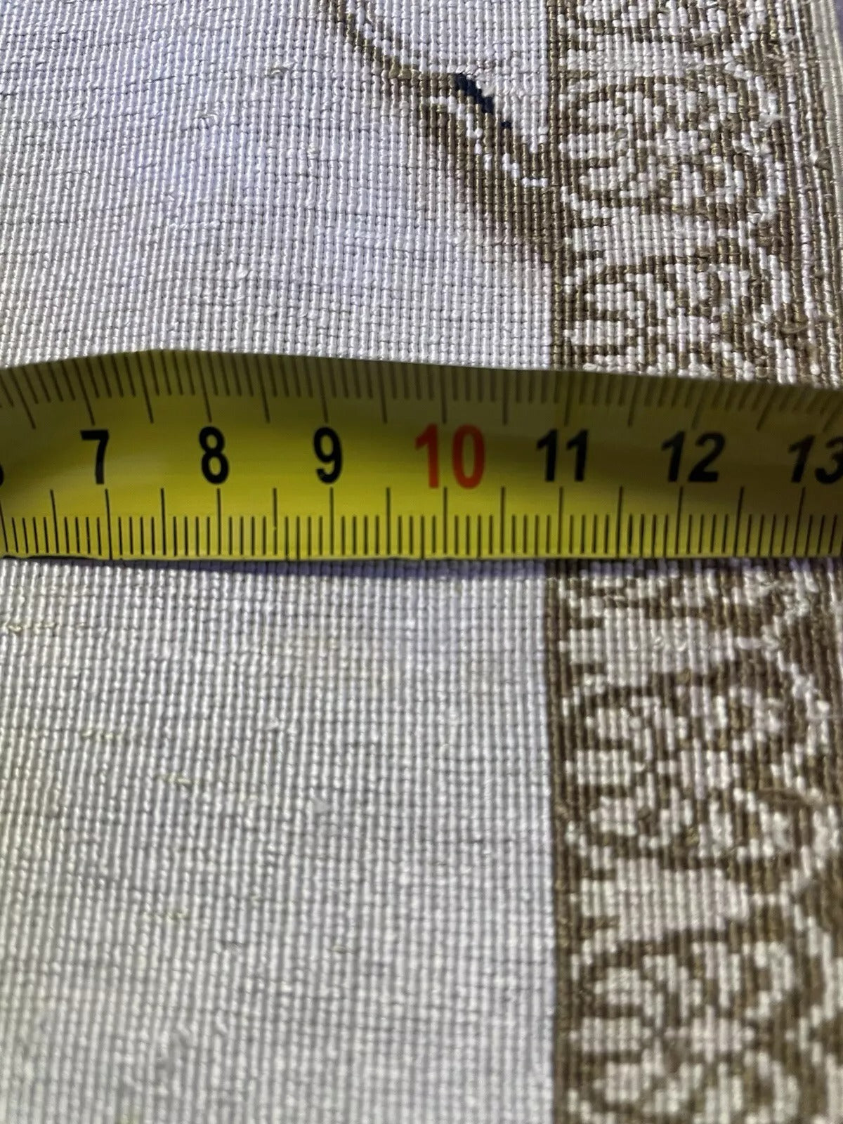 Comparison showing rug's palm-sized dimensions