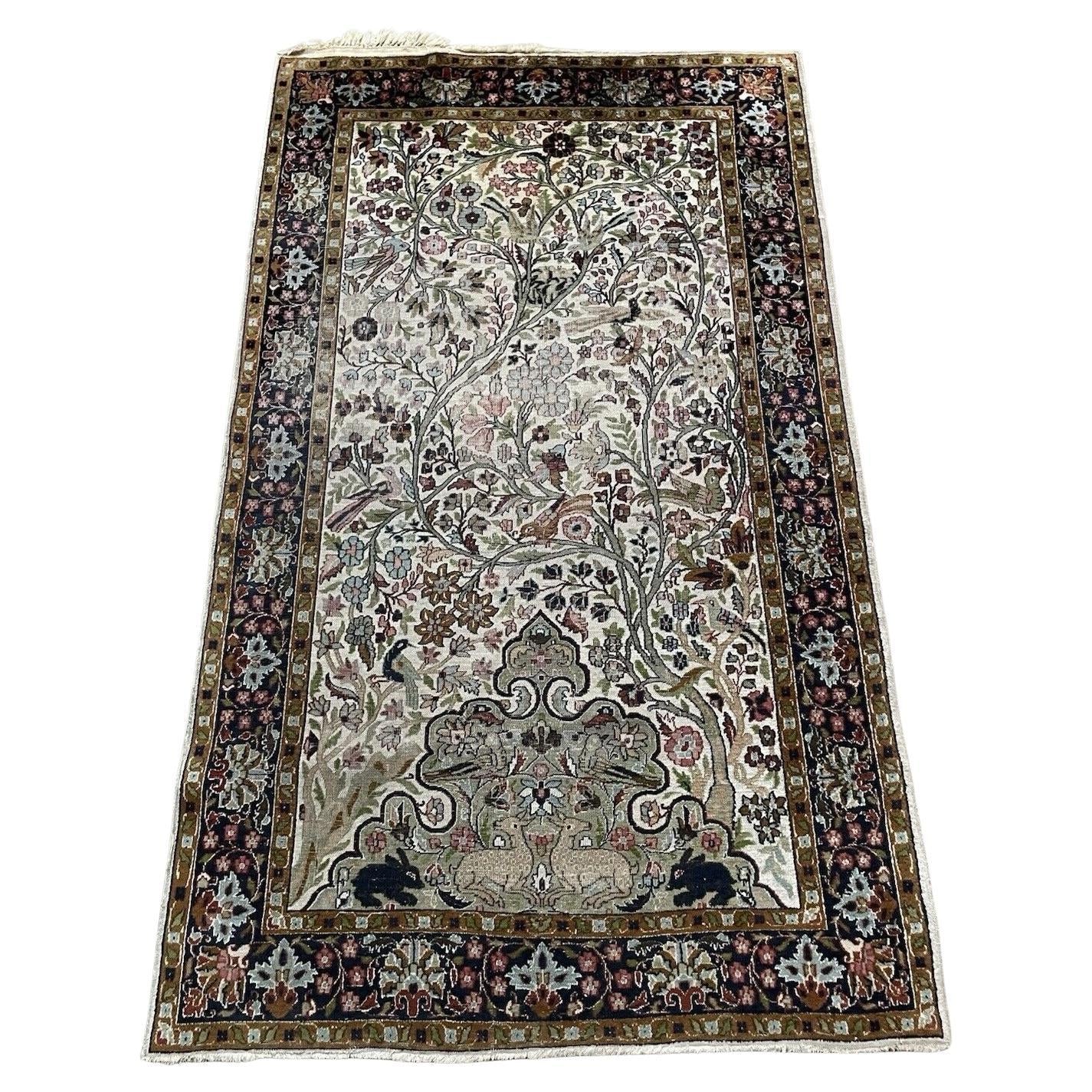 Full top view of the antique Indian Agra rug showing the complete Tree of Life design.