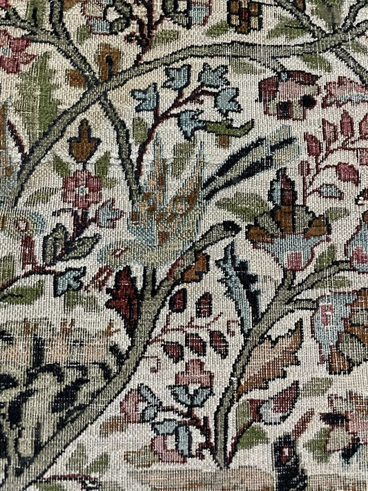 Close-up detail of the central Tree of Life motif with its intricate branches.