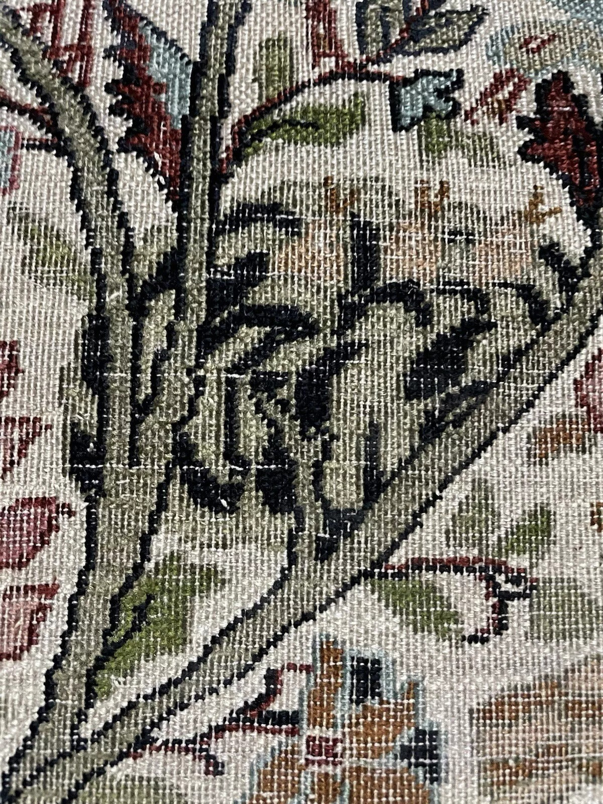 Detail of a deer and other animal figures surrounding the tree.