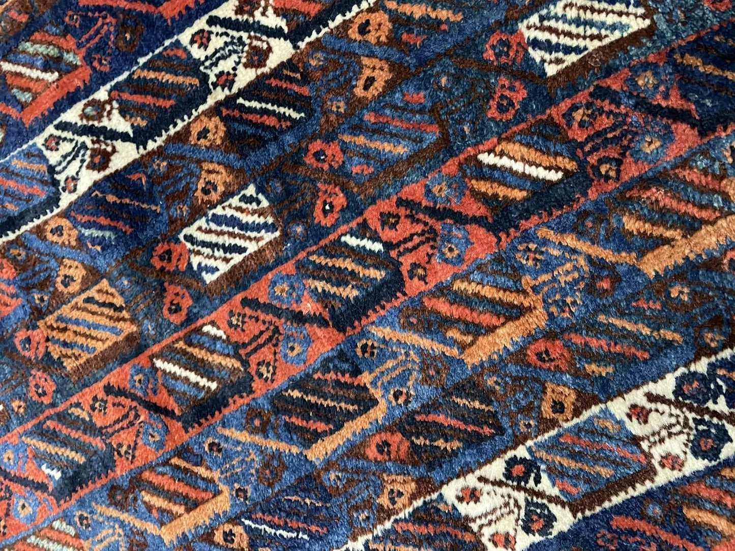 Shot of the rug's border, illustrating its complementary geometric pattern.
