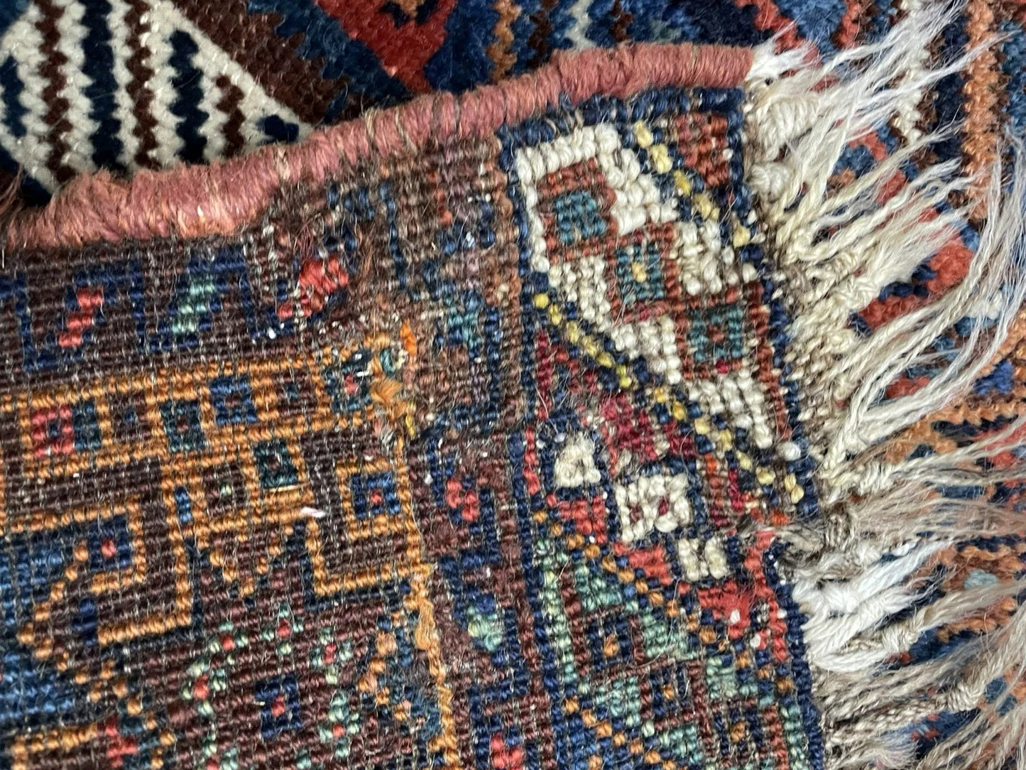 A section of the rug displaying the rhythmic repetition of the tile design.