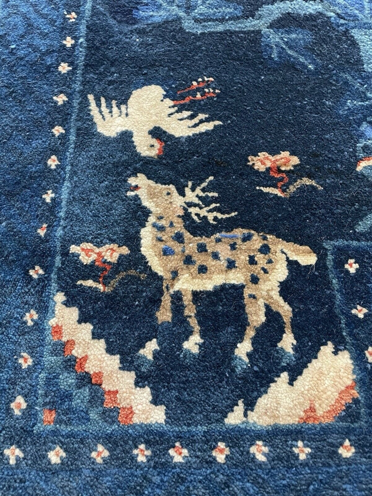 Close-up on the gentle patina and aged surface of the antique wool.