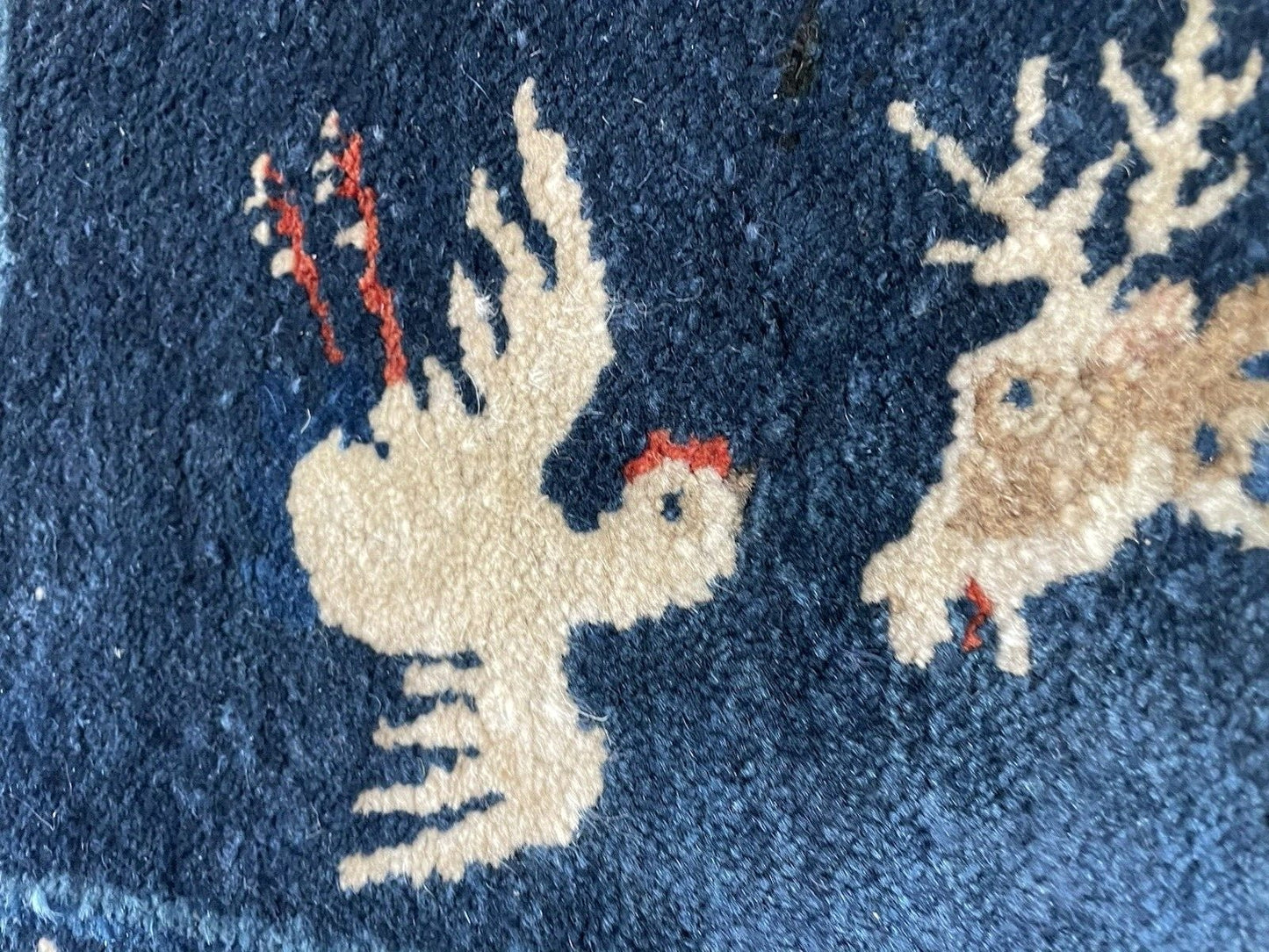 Detail of the rug's corner, showing the meeting of the border and field designs.