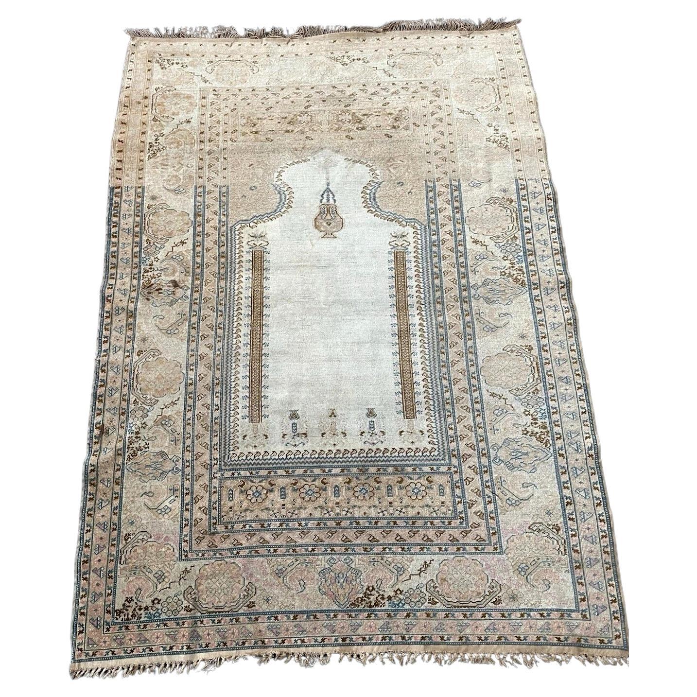 Full top view of the antique Turkish Ghurdes prayer rug showing the complete mihrab design.