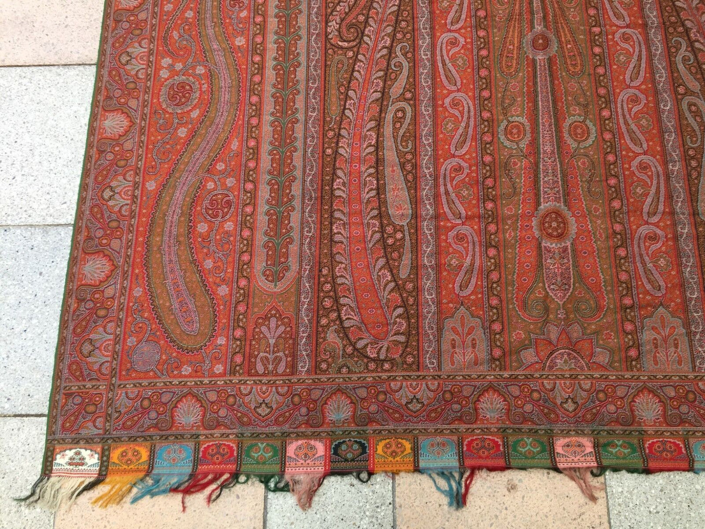 Side view of the shawl displaying its generous dimensions and intricate patterns