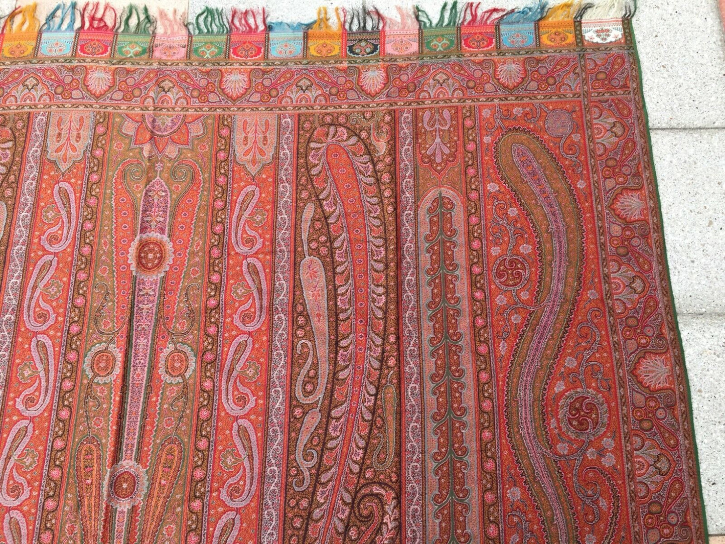 Close-up of the intricate border designs surrounding the central motif