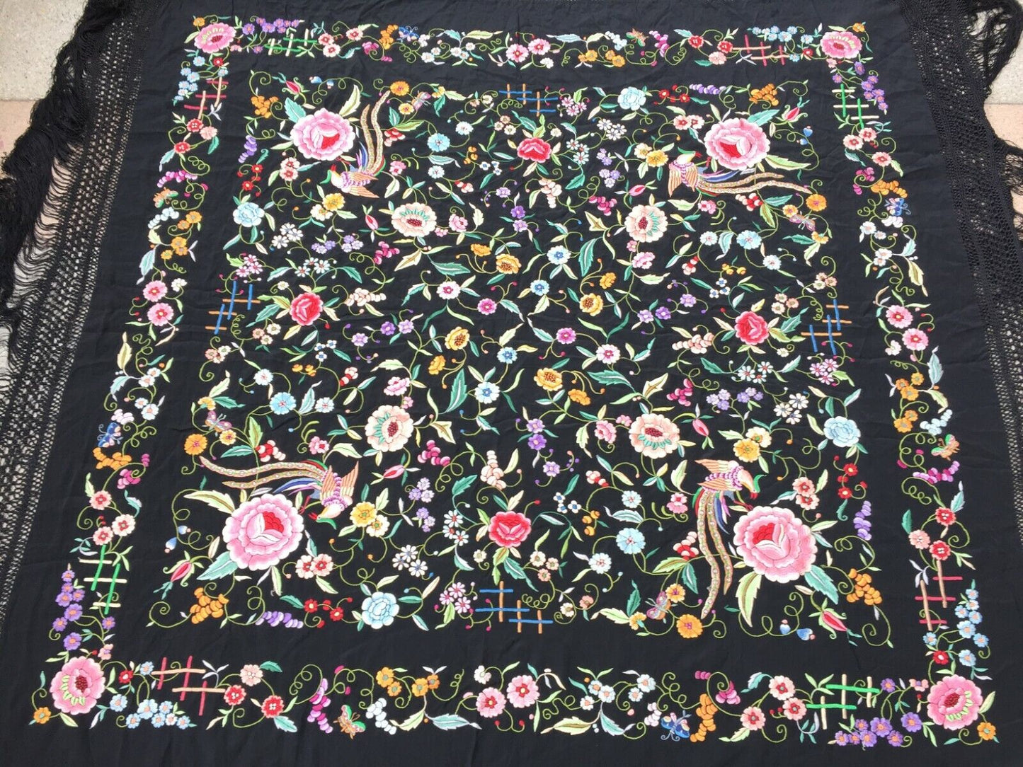 Close-up of the detailed floral patterns woven into the silk fabric