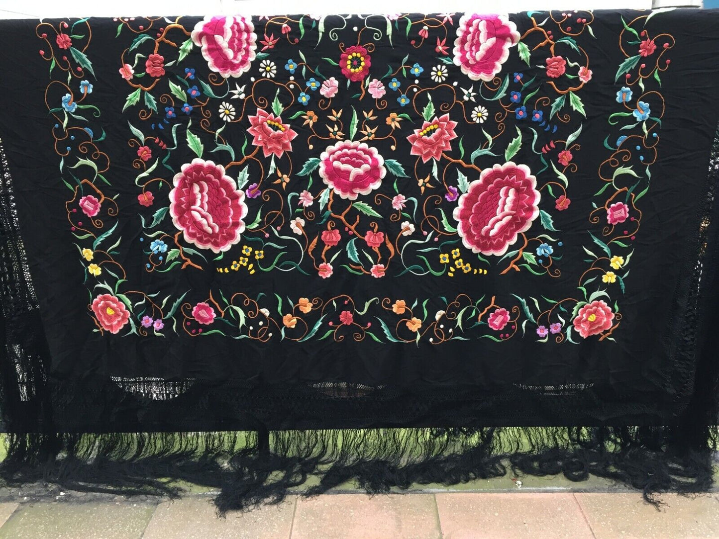 Side angle view of the shawl, highlighting its thickness and luxurious texture