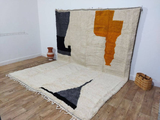 Close-up of geometric white motifs on pink and orange field