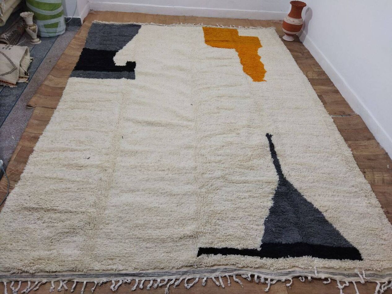 Wool pile texture and color warp on vintage Berber rug