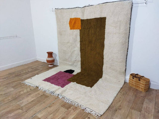 Brown rectangle motif on warm neutral wool field close-up