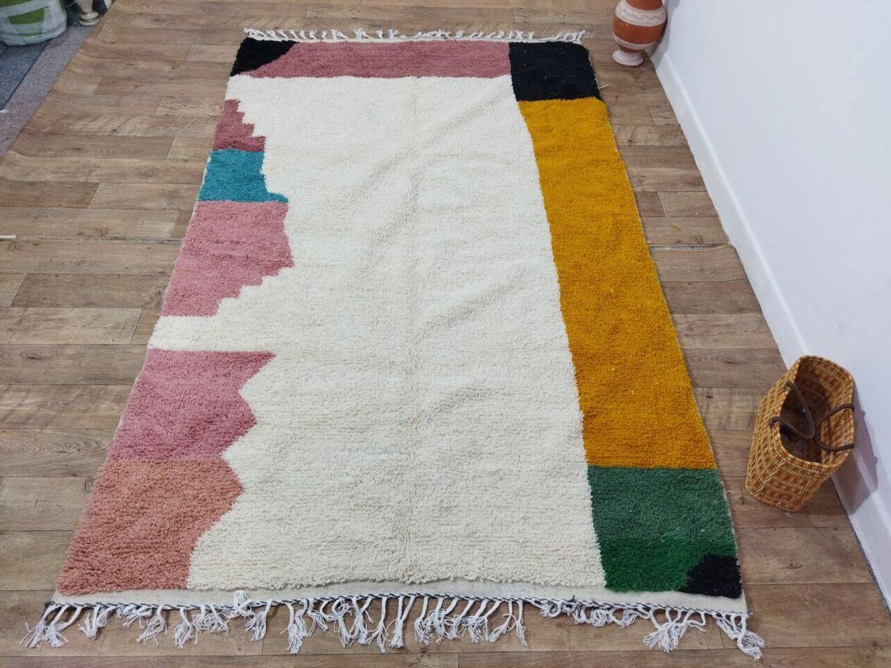 Teal and green color blocks on wool pile