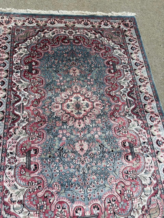 Intricate floral motifs on crimson field