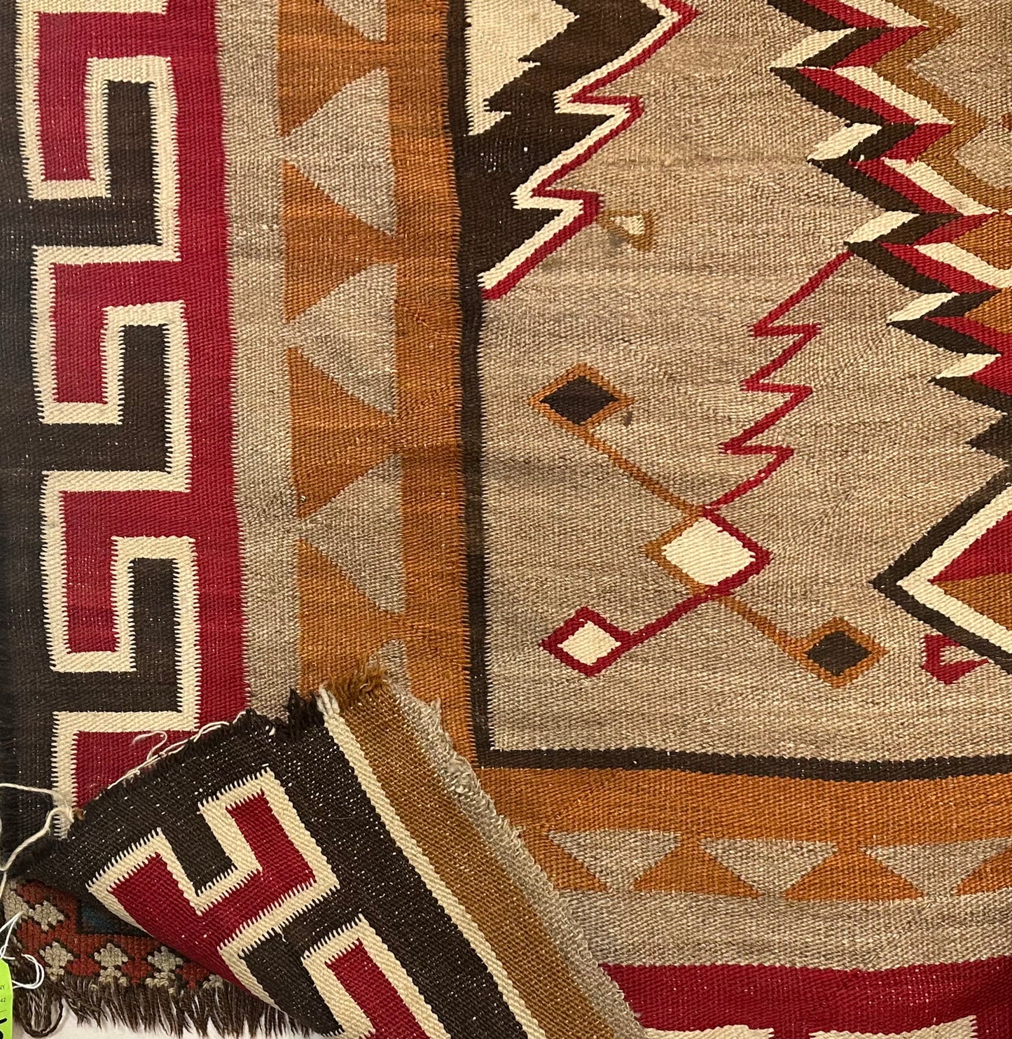 Antique Navajo rug showing traditional handwoven craftsmanship.