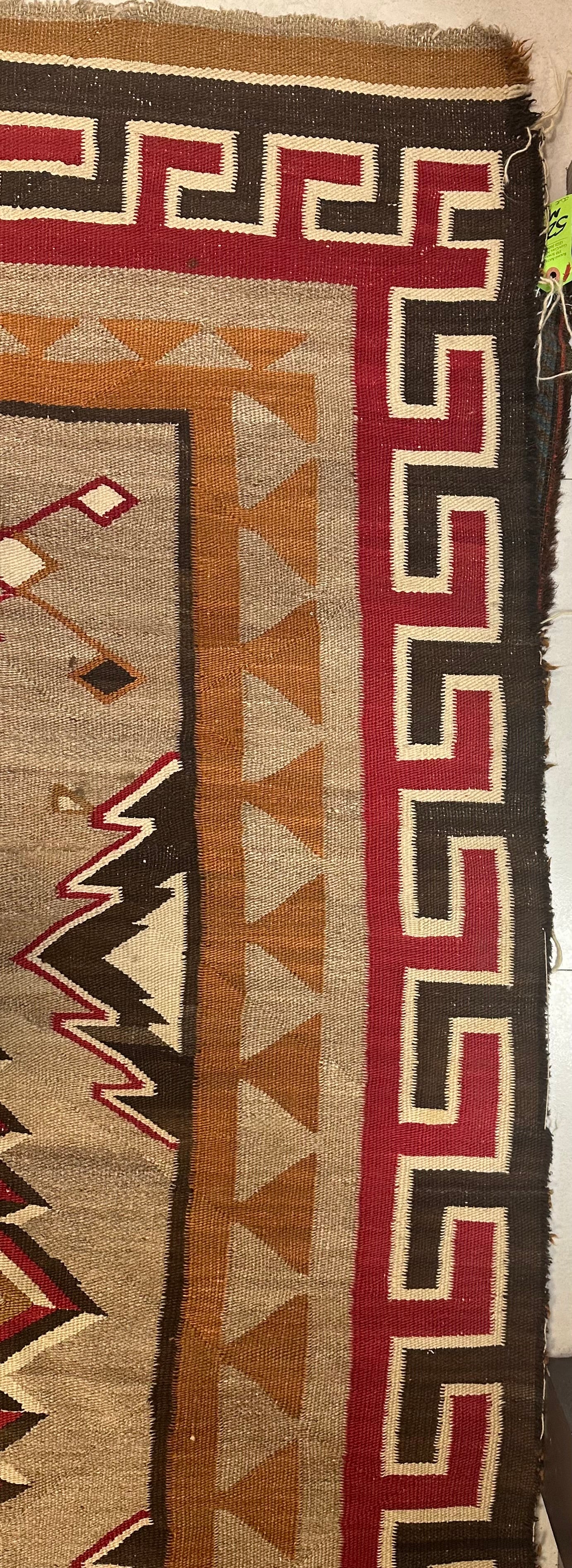 1880s rectangular Navajo wool rug with rich historical details.
