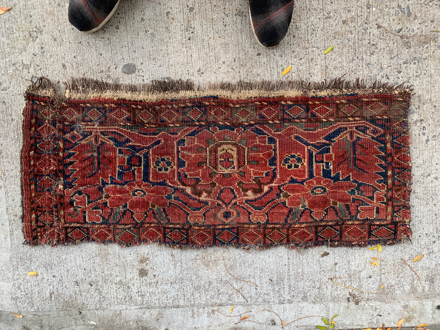 Hand-knotted wool rug showcasing 19th-century Afghan craftsmanship.