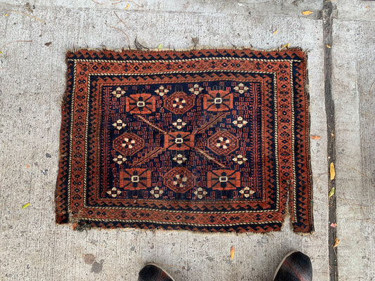 Close-up of geometric patterns on a Baluch tribal bagface.