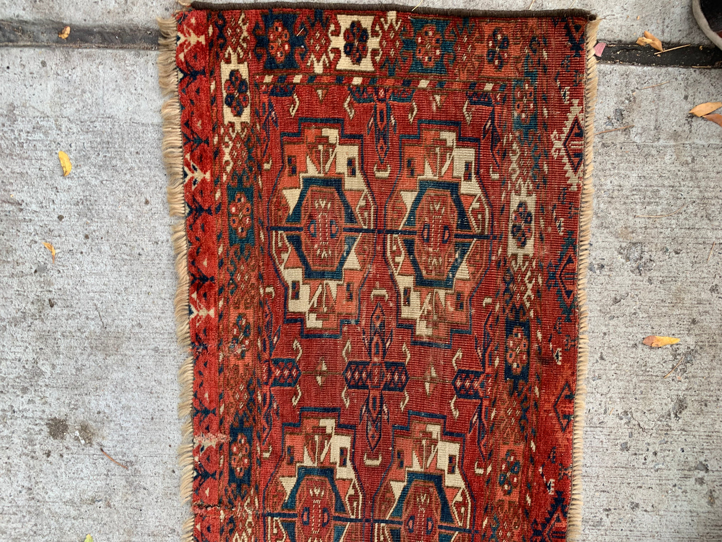 Close-up of octagonal medallions on a Tekke tribal rug.