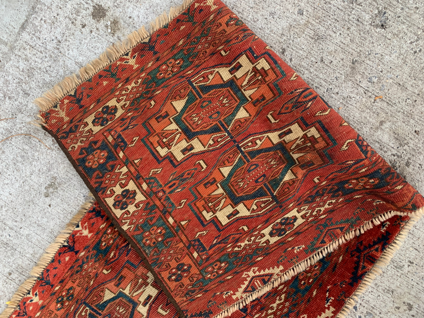 Antique Turkmen Tekke Torba rug with warm earthy tones.