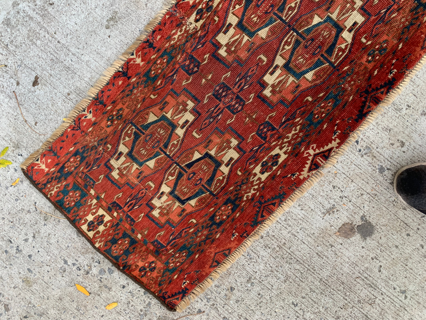 Antique Tekke rug with intricate geometric and floral motifs.