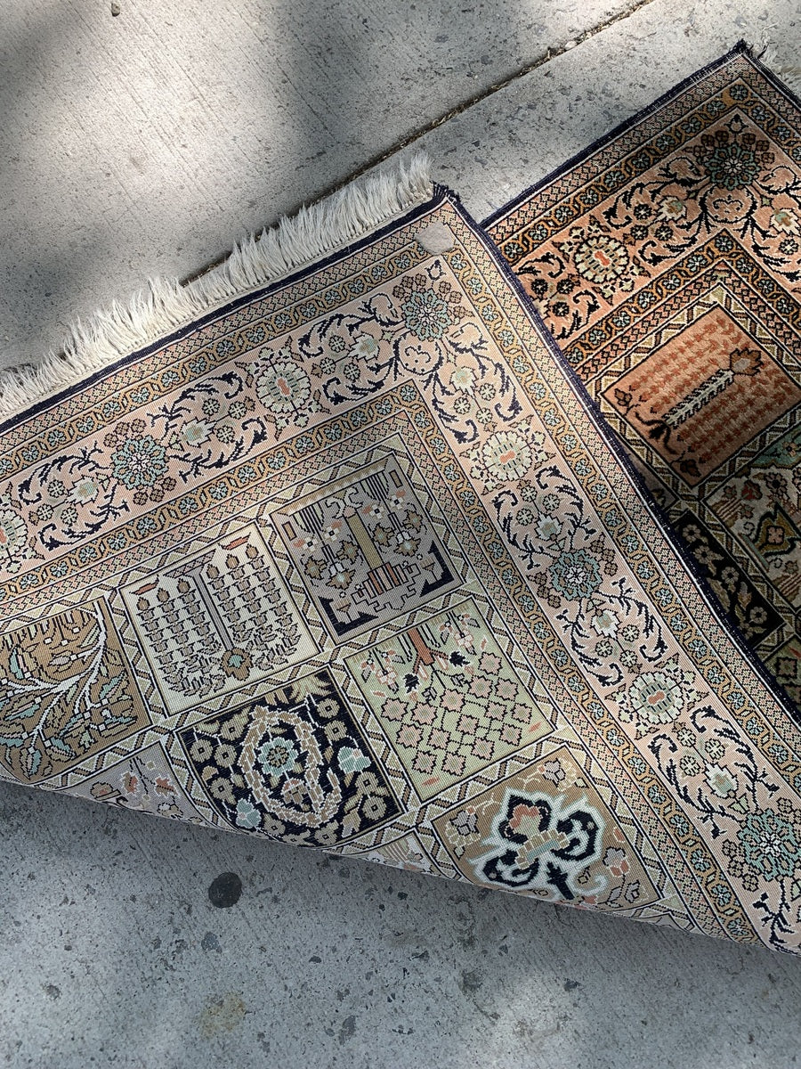 Small Persian silk rug for wall hanging or home decor.