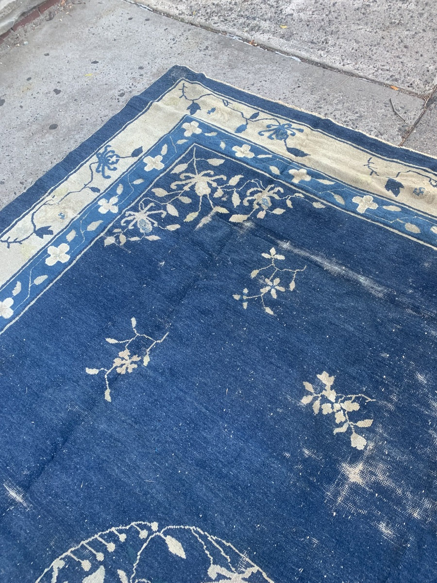 Handmade wool Peking rug with traditional design elements.