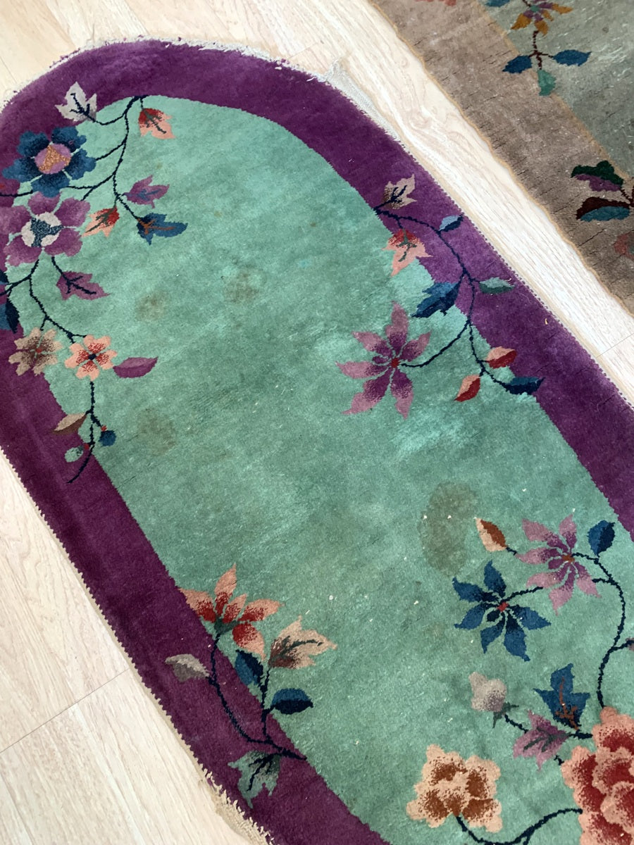 Close-up of the floral motifs on a vintage Chinese rug.