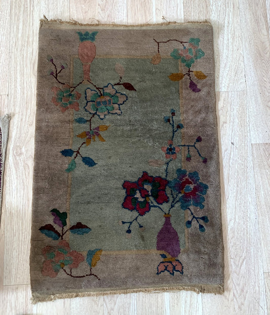 Detailed view of the vibrant red, blue, and mustard yellow floral patterns.