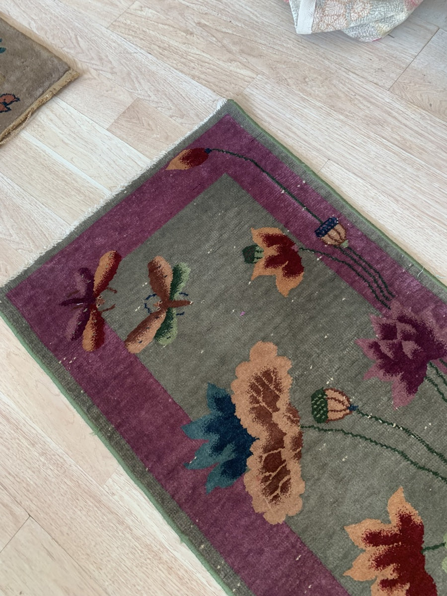 Edge detailing of the antique hand-knotted Chinese wool rug.