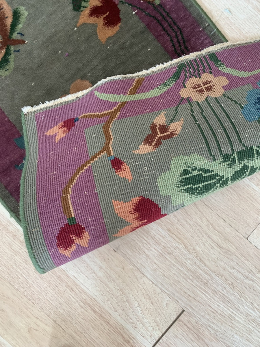 Plum-colored border with a fine green outer edge.