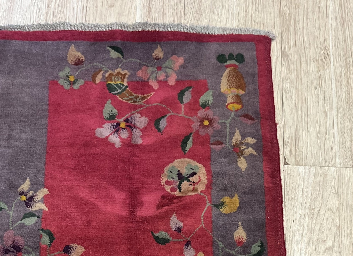 Vibrant color combination of gold, green, pink, and blue on the rug