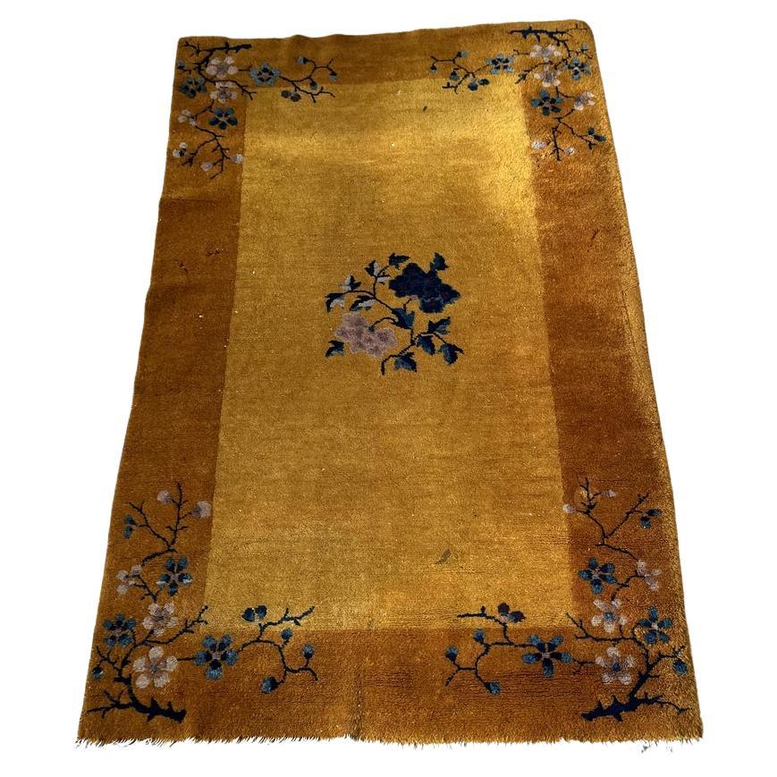 Handmade antique 1920s Art Deco Chinese wool rug with floral motifs