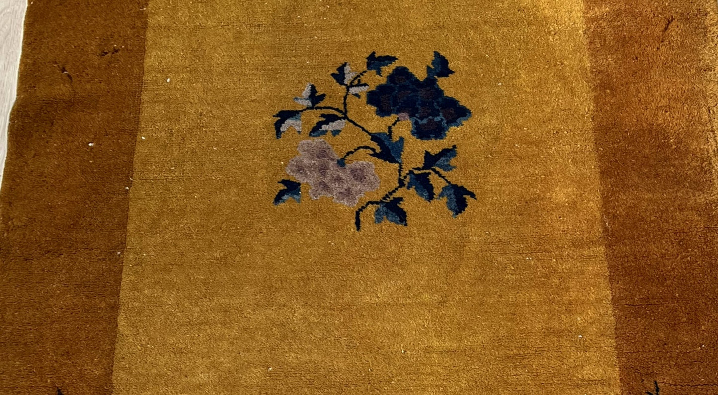 Graceful floral and botanical elements on the 1920s Chinese rug