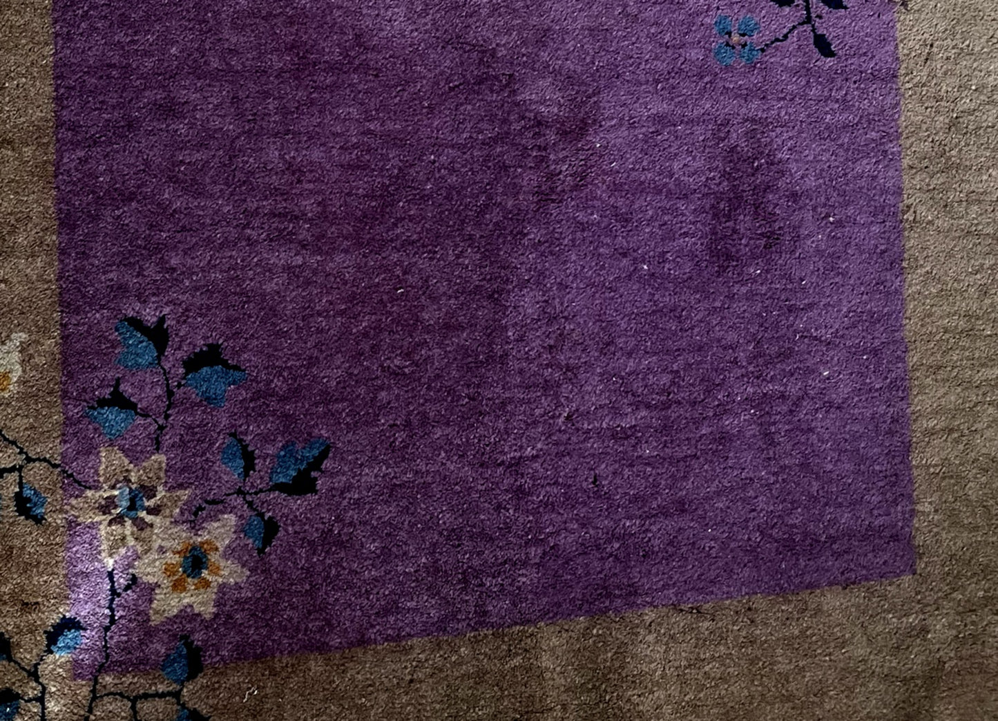 Intricate floral detailing symmetrically placed in the corners