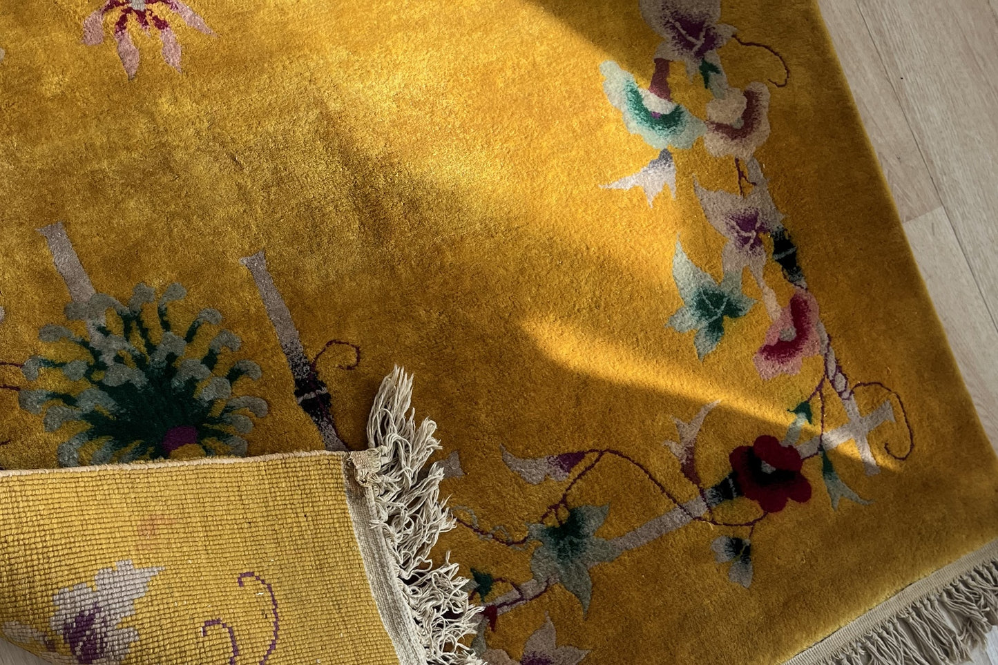 Textured wool fibers of the vintage Chinese rug
