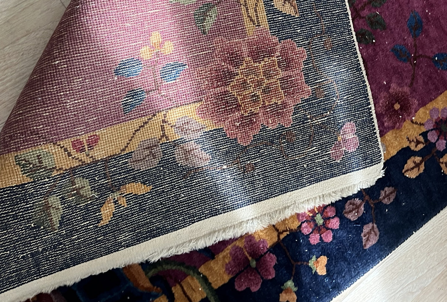 Textured wool fibers of the vintage Chinese rug