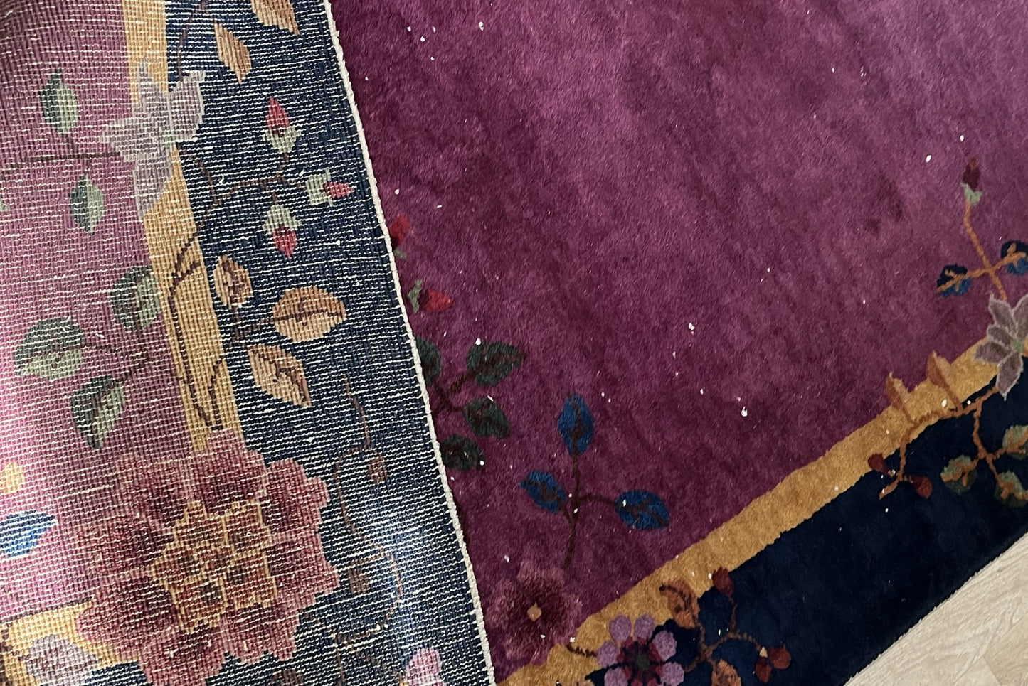 Back of the antique rug showing traditional handmade weaving
