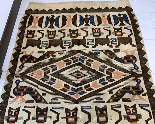 Close-up of intricate geometric patterns and stylized figures