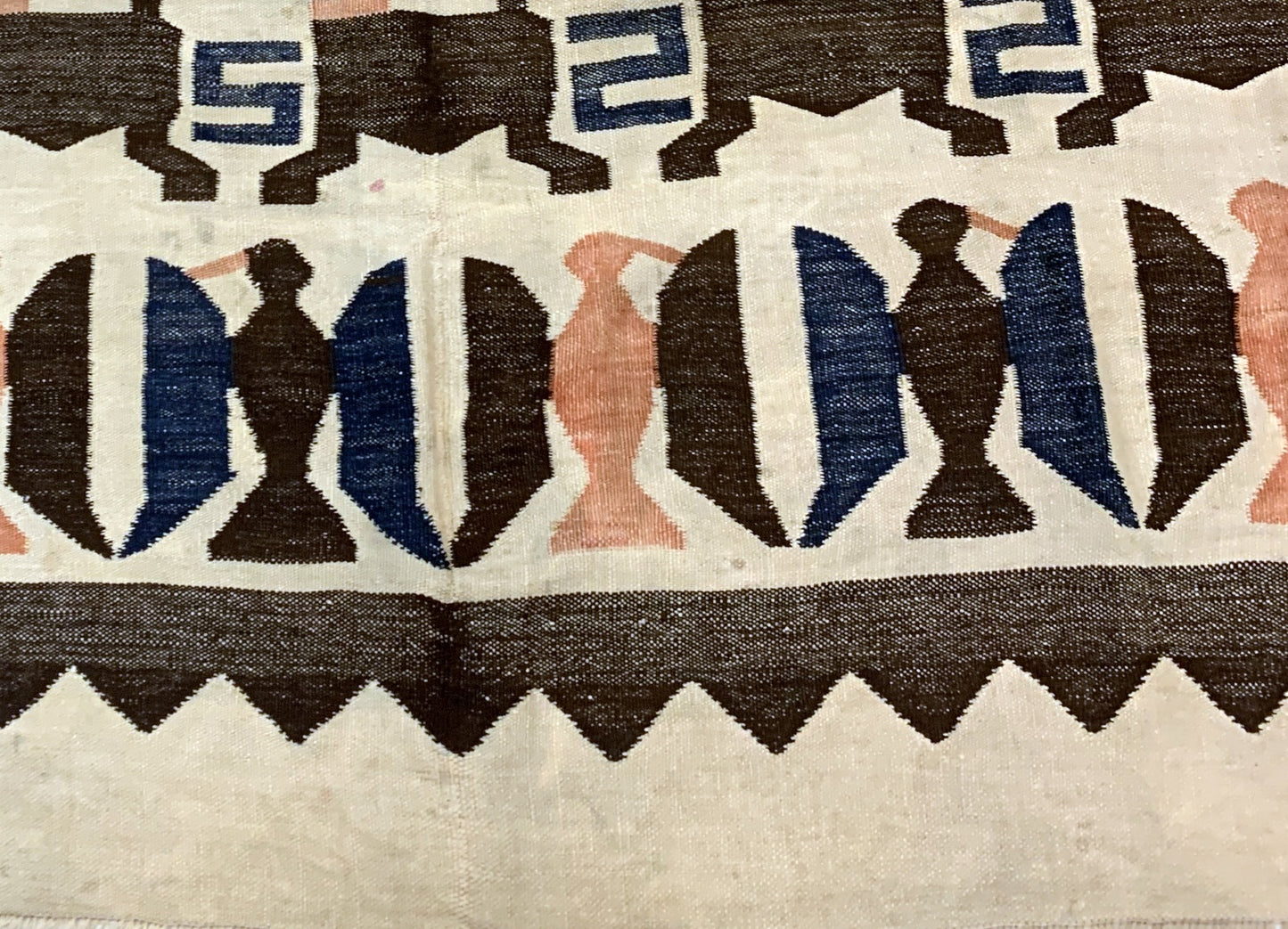 Antique Peruvian Kilim displayed in a bohemian interior