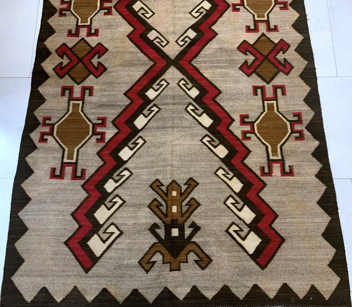 Vintage handwoven Native American rug with geometric designs