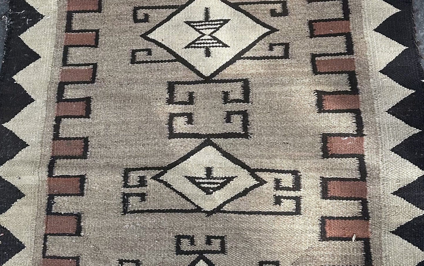 Full-length image of the 2.3' x 5.2' Native American rug