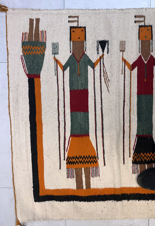 Textile with tribal figure design on a white background