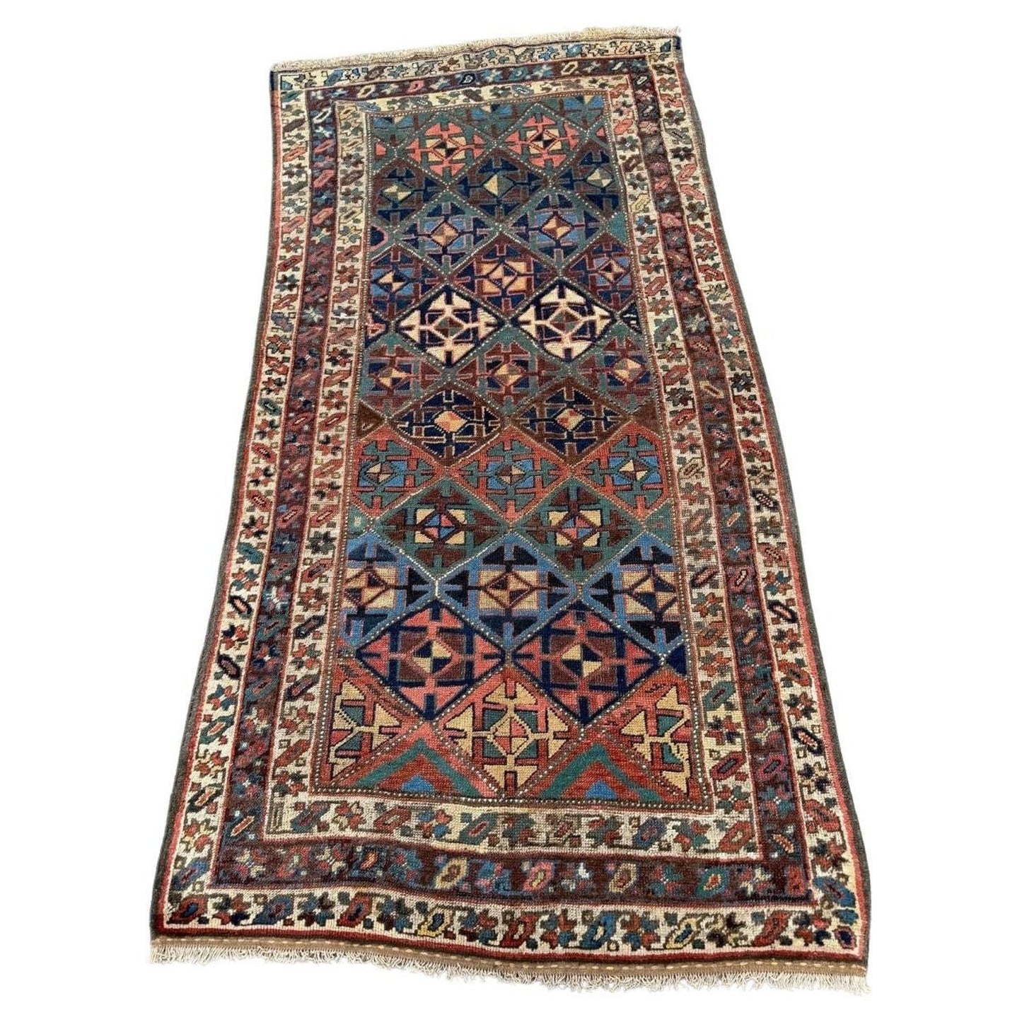 Full view antique Kurdish rug with green, blue, red tribal motifs